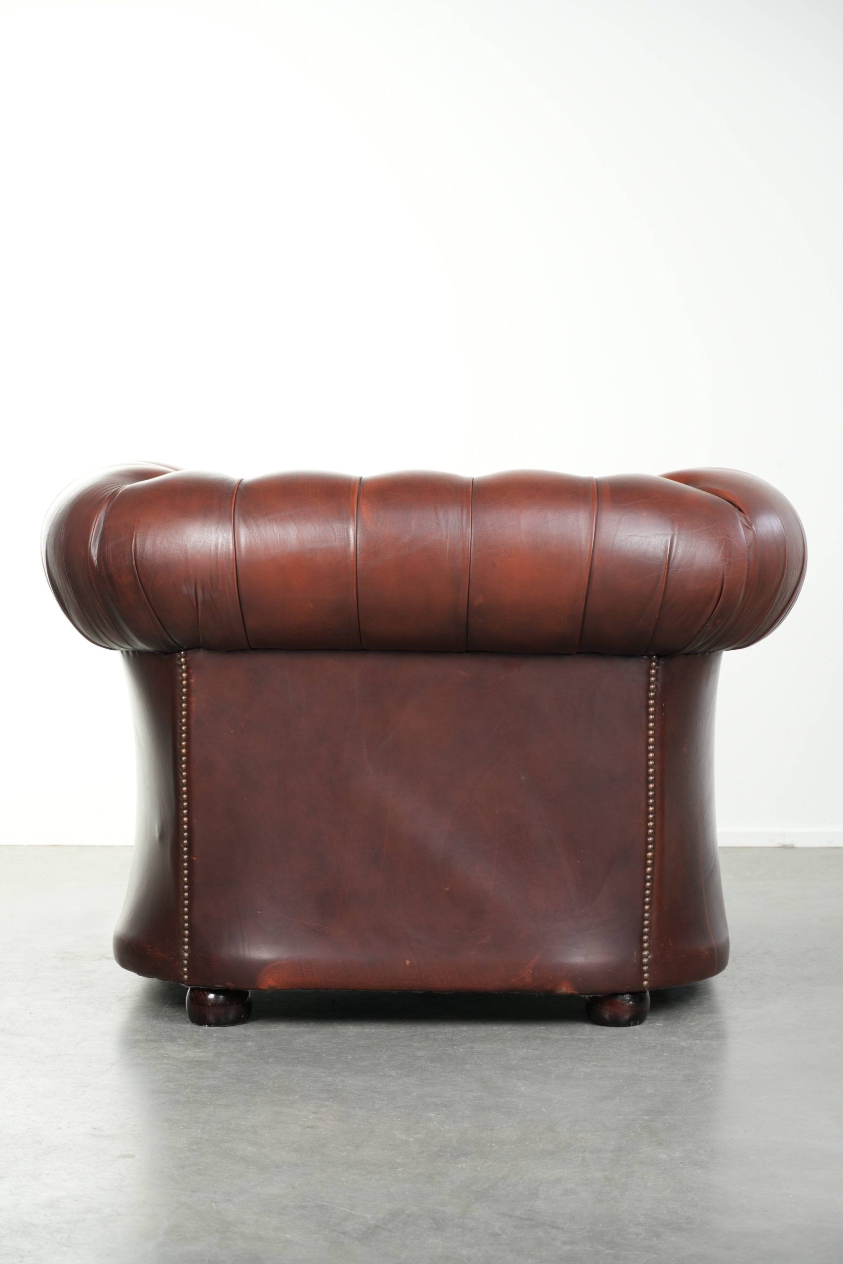 Cowhide Chesterfield armchair in a classic English style