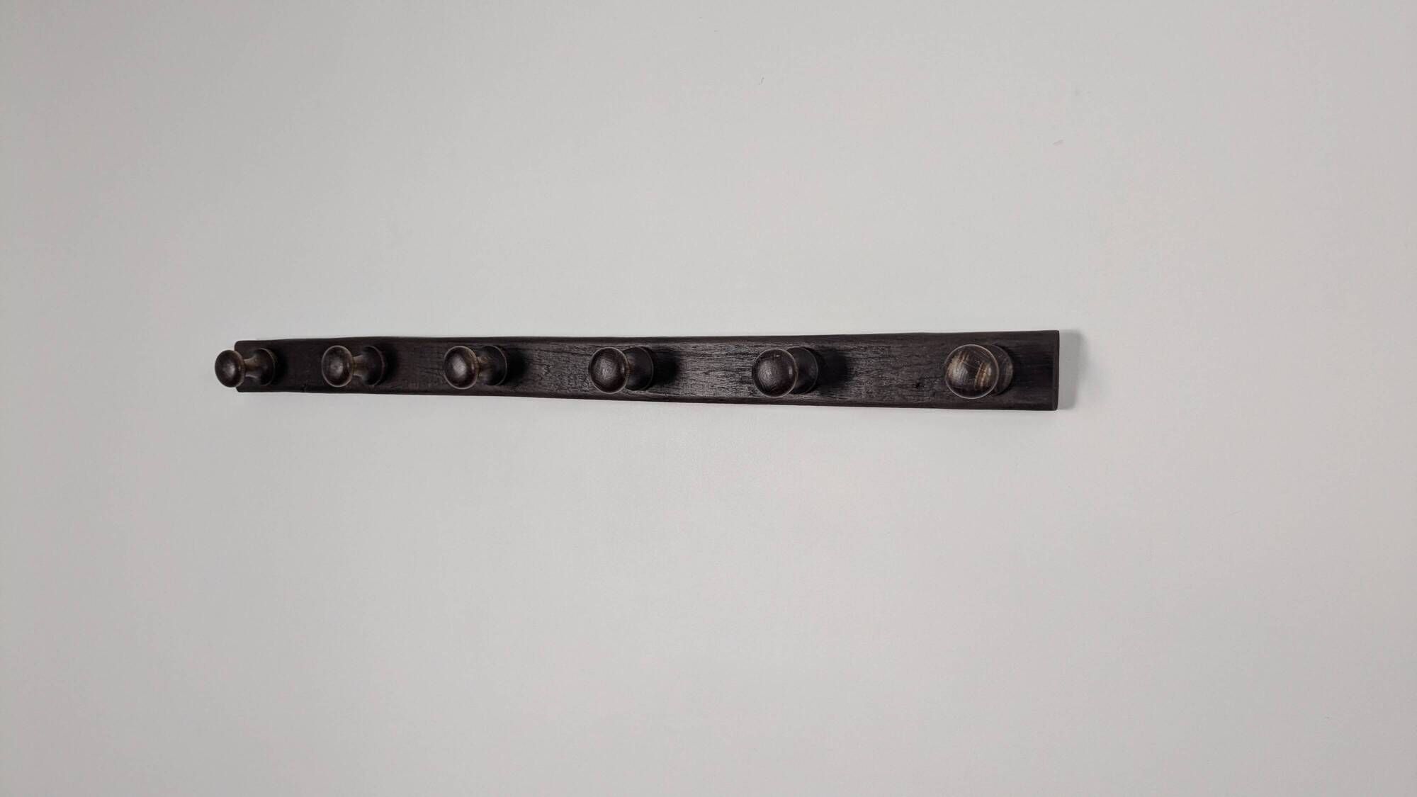 Antique turned wooden coat rack with 6 hooks, rustic spirit.