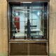Early 20th-century shop display cabinet in oak with sliding doors.