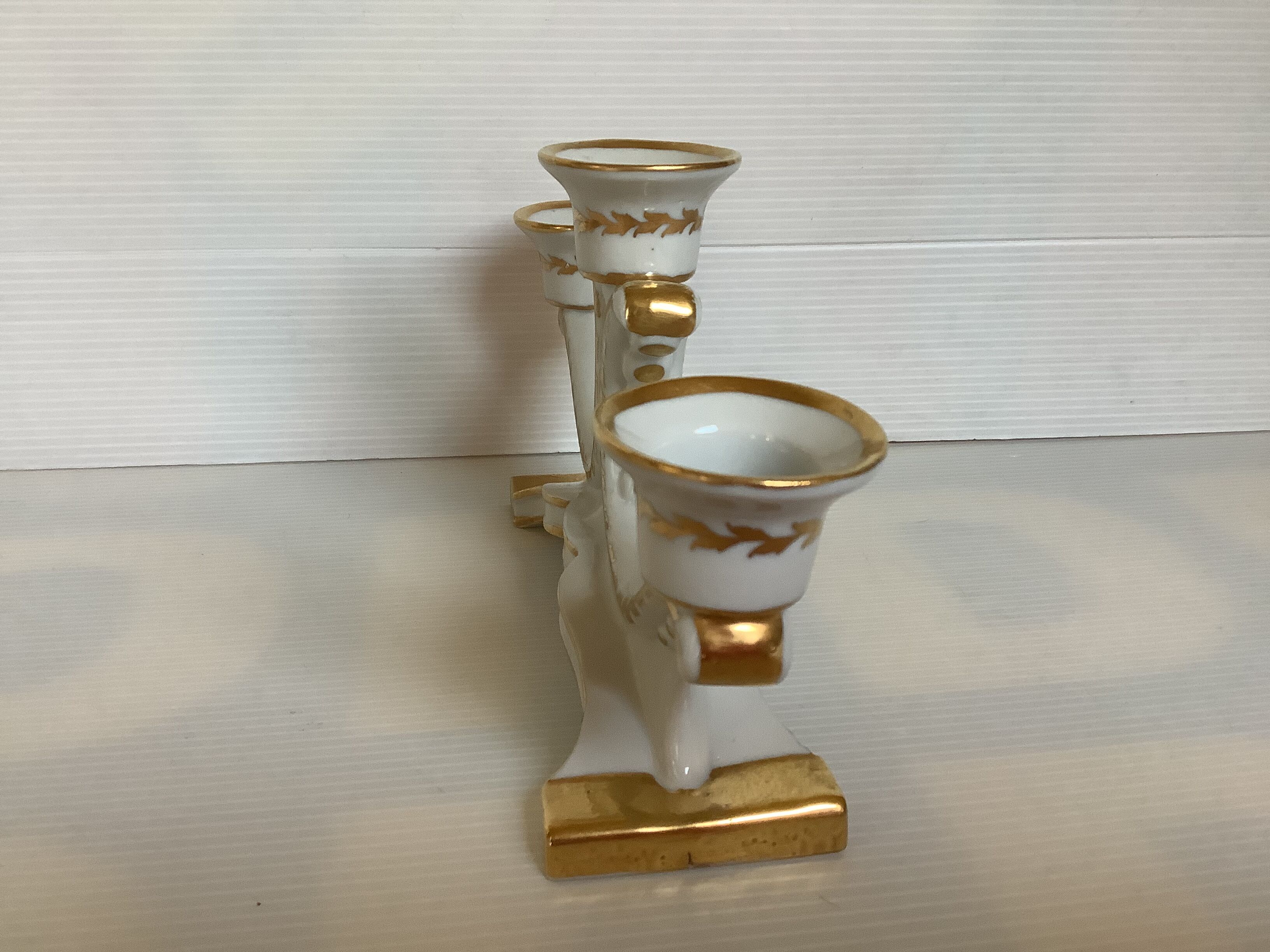 Old white and gold candlestick Belgium