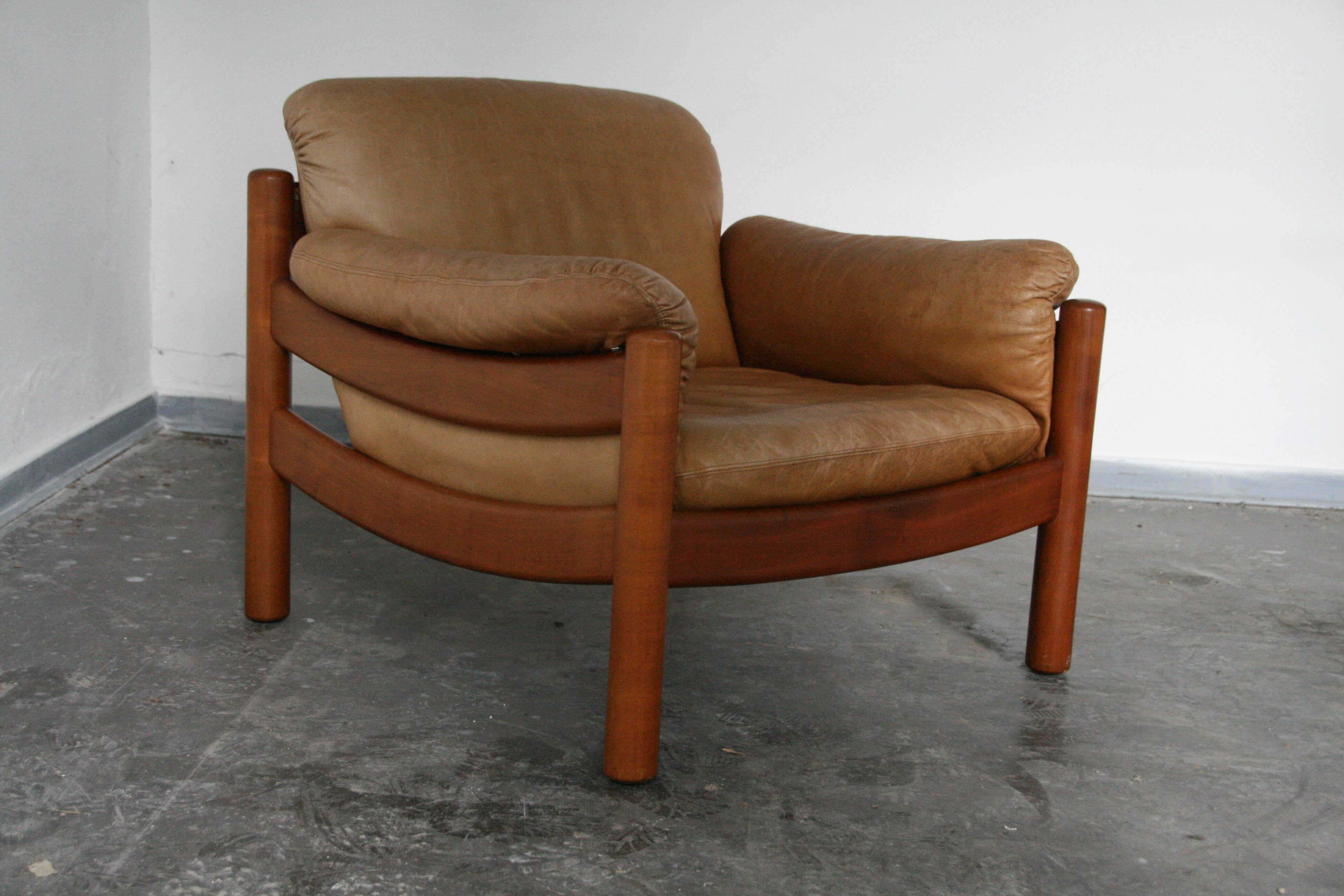 Teak and leather club armchairs