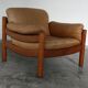 Teak and leather club armchairs
