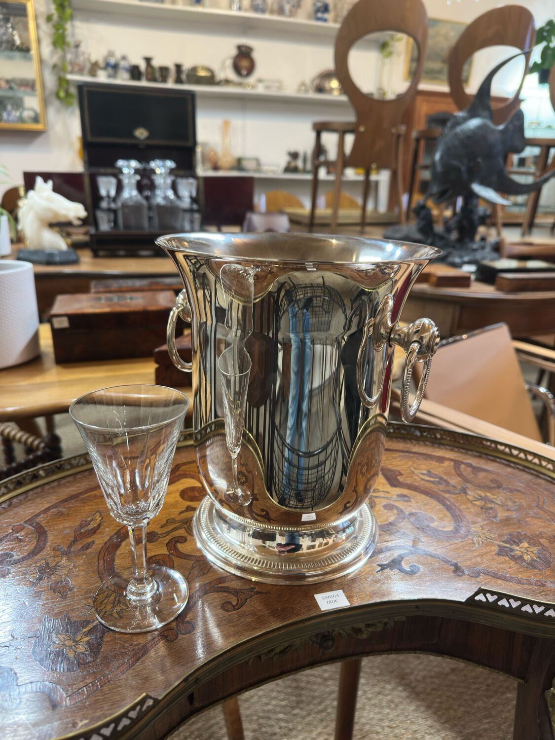 Silver-plated champagne bucket with ring handles.