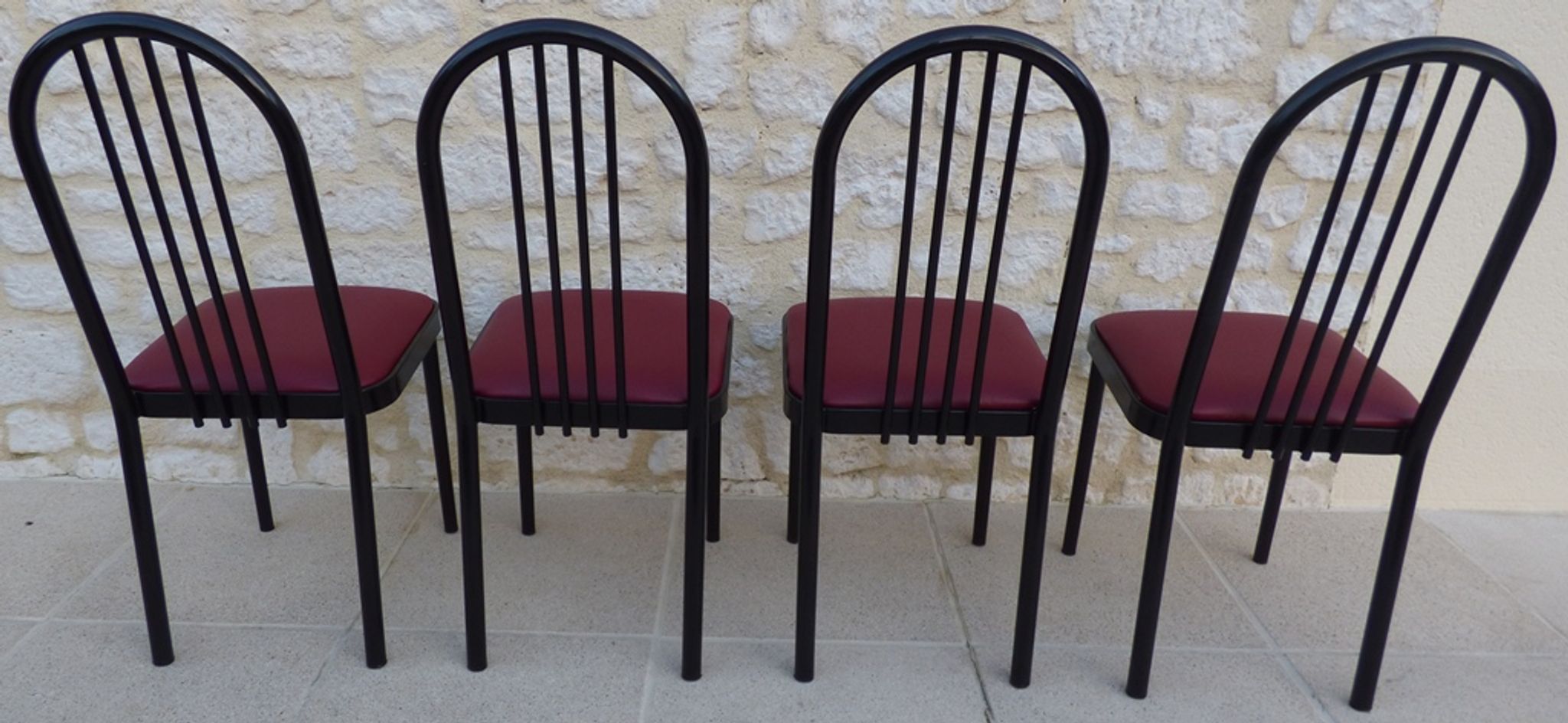 4 metal chairs with burgundy imitation leather seats from the Souvignet brand