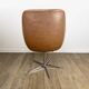1970s swivel chair with faux leather shell and chrome.