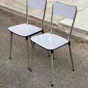 2 beige Formica and steel chairs from the 1980s.
