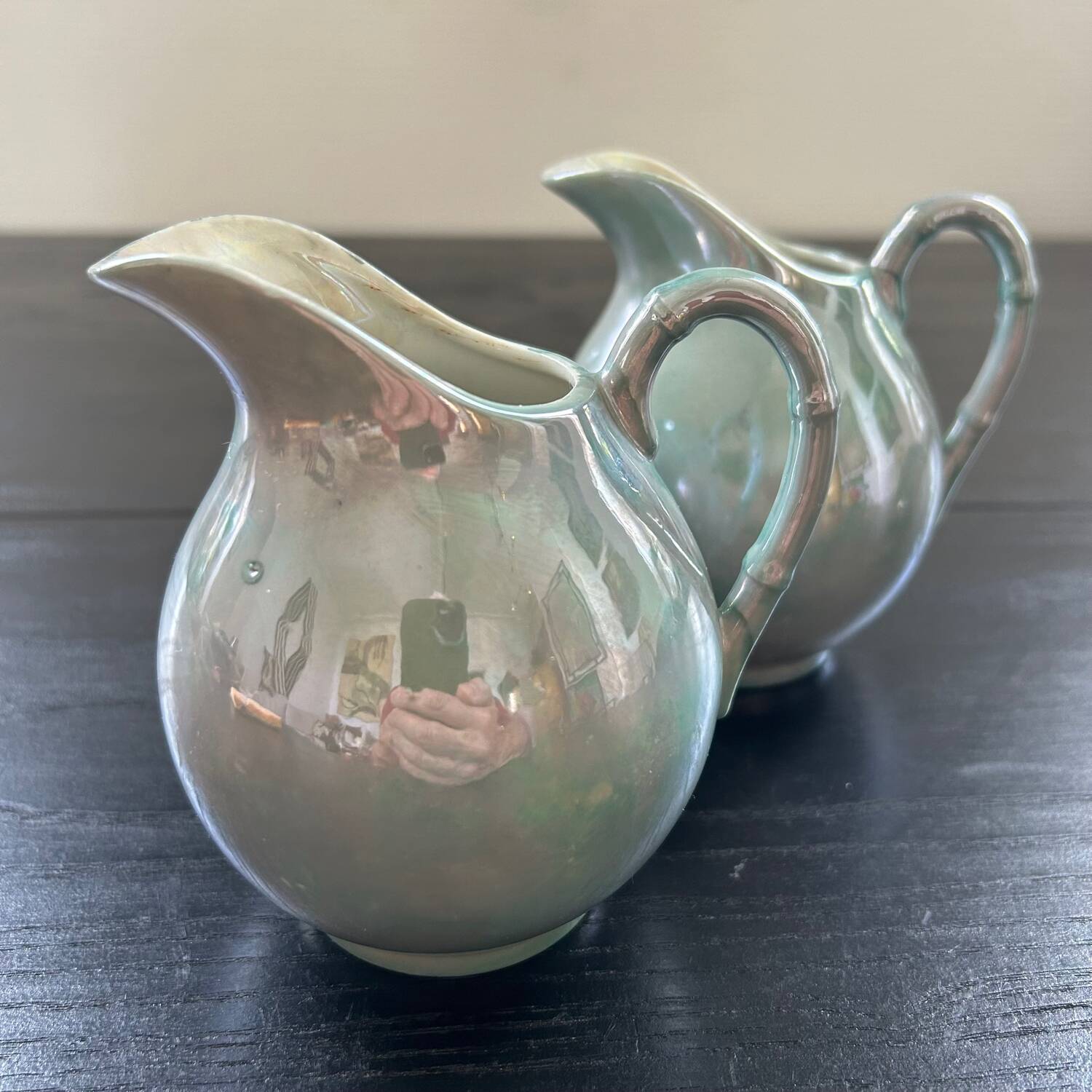 Pair of iridescent blue pitchers