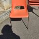 6 orange chairs