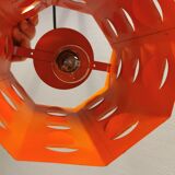 Danish Space-Age hanging lamp from the 80s, made in orange metal with cut-outs.