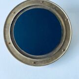 Porthole mirror in gilded brass