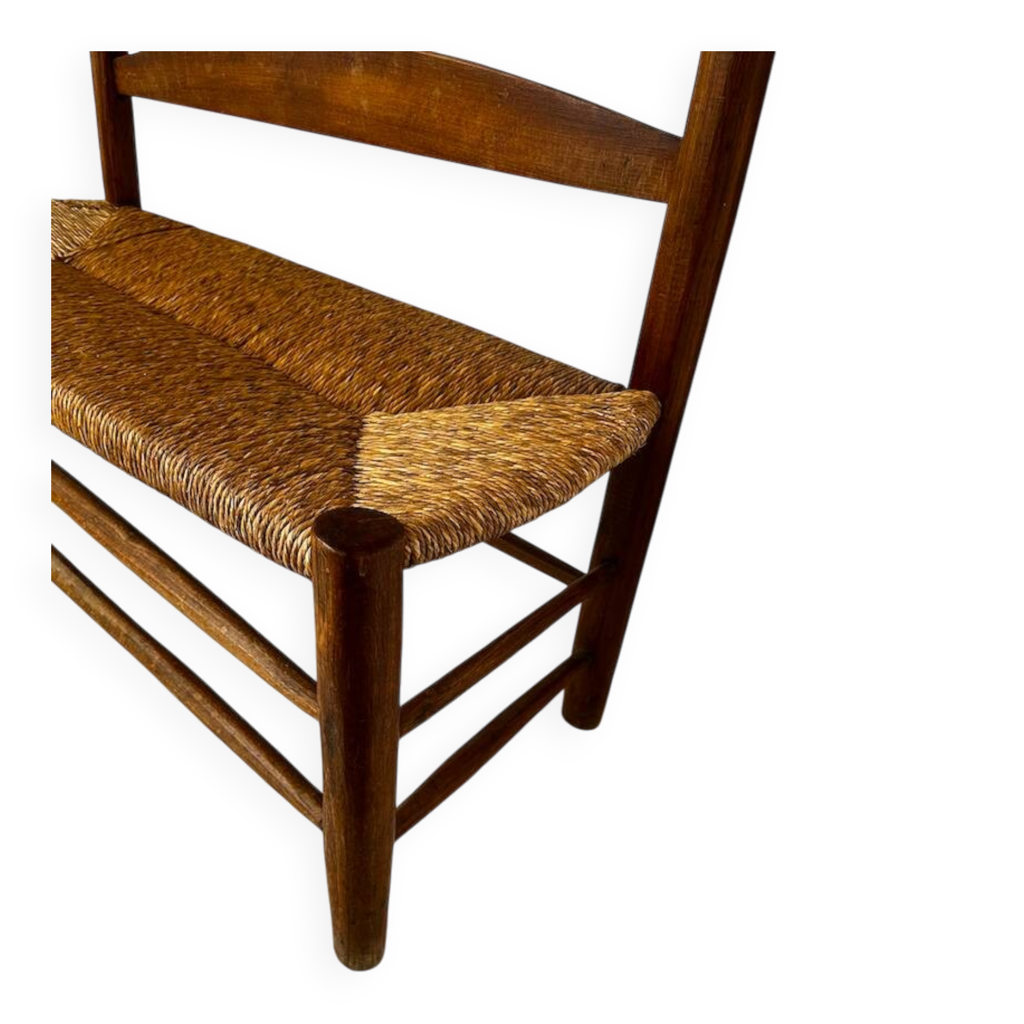 Old wooden and straw bench