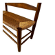 Old wooden and straw bench