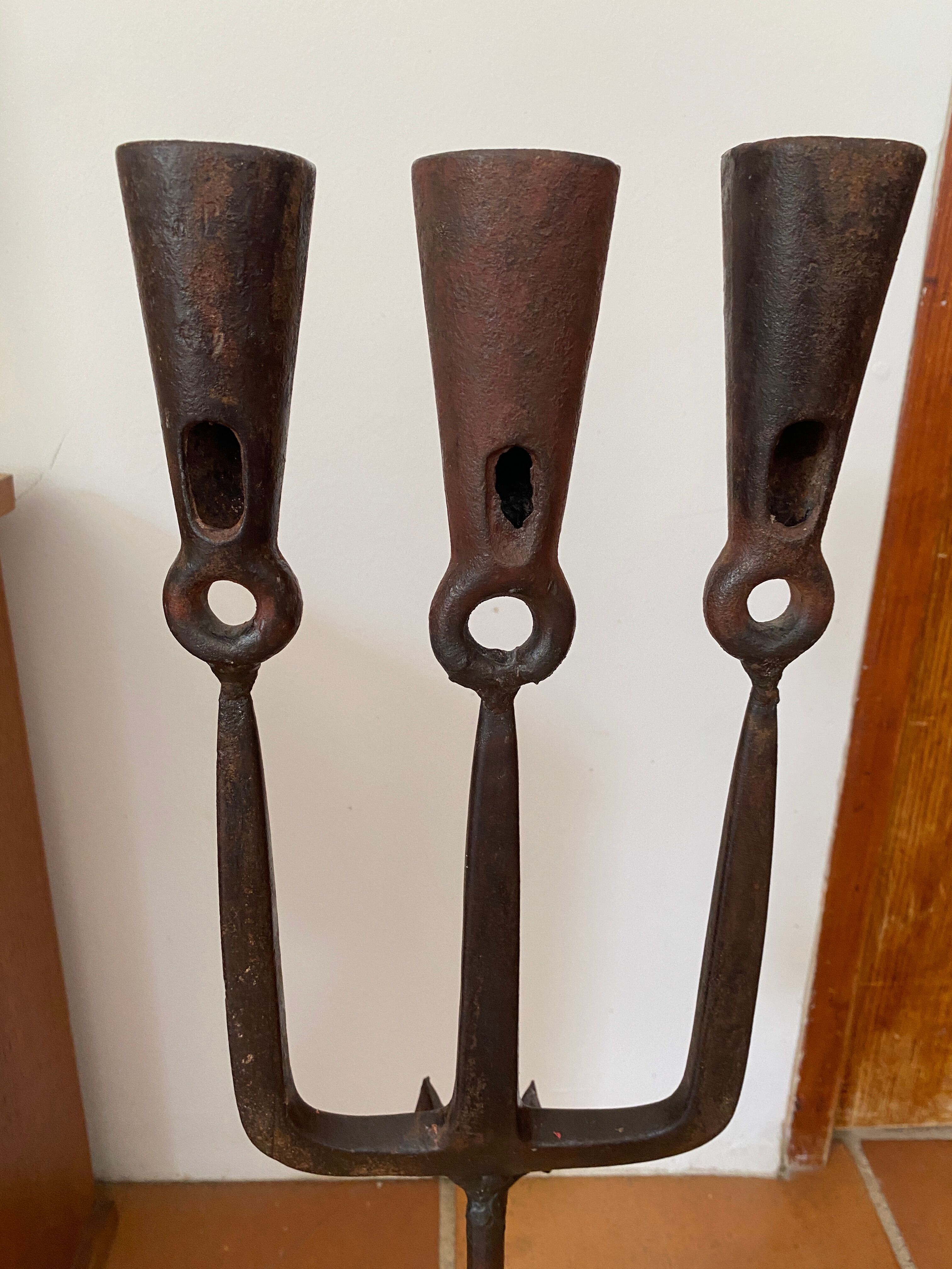 Brutalist iron candlestick on a stand