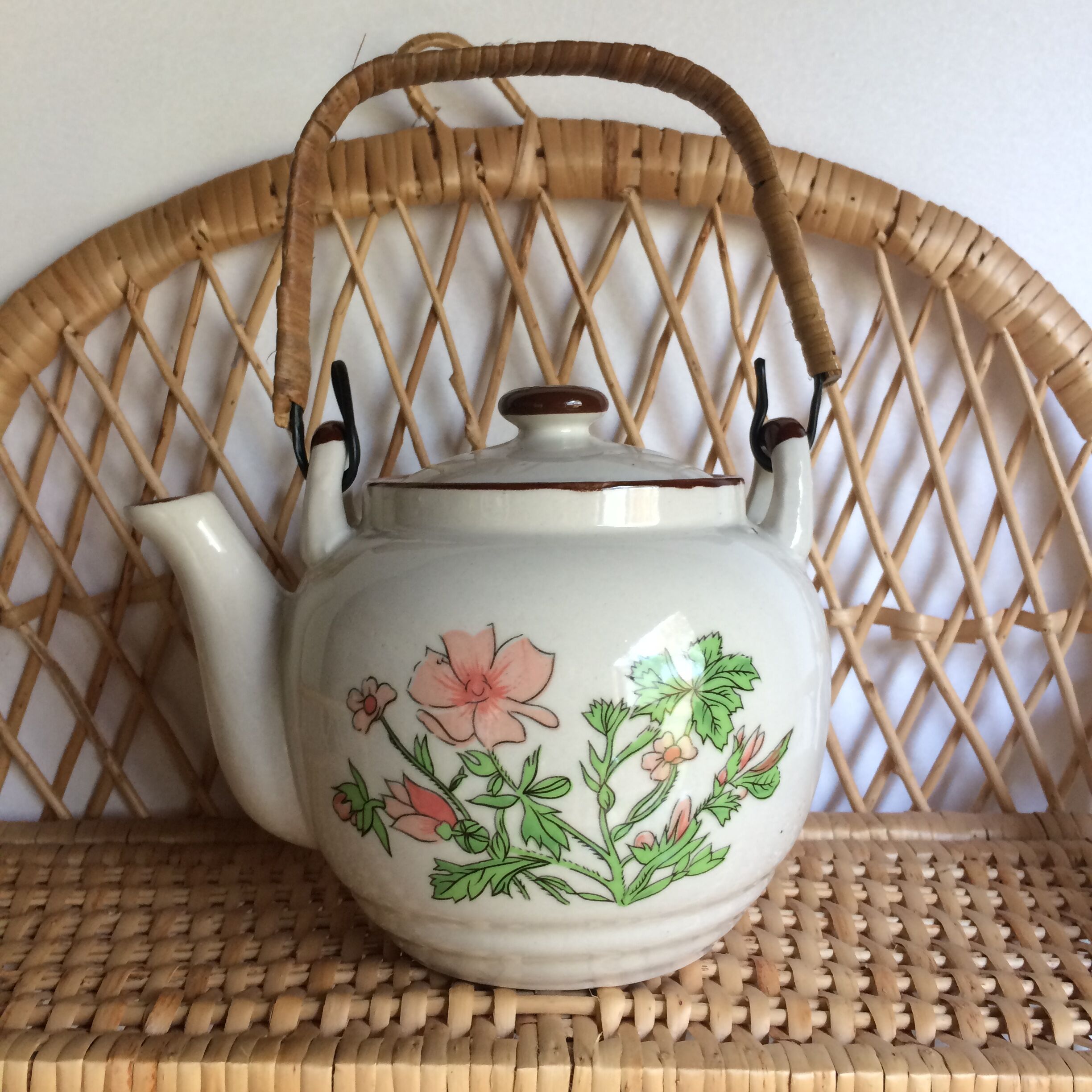 Vintage teapot with wicker handle