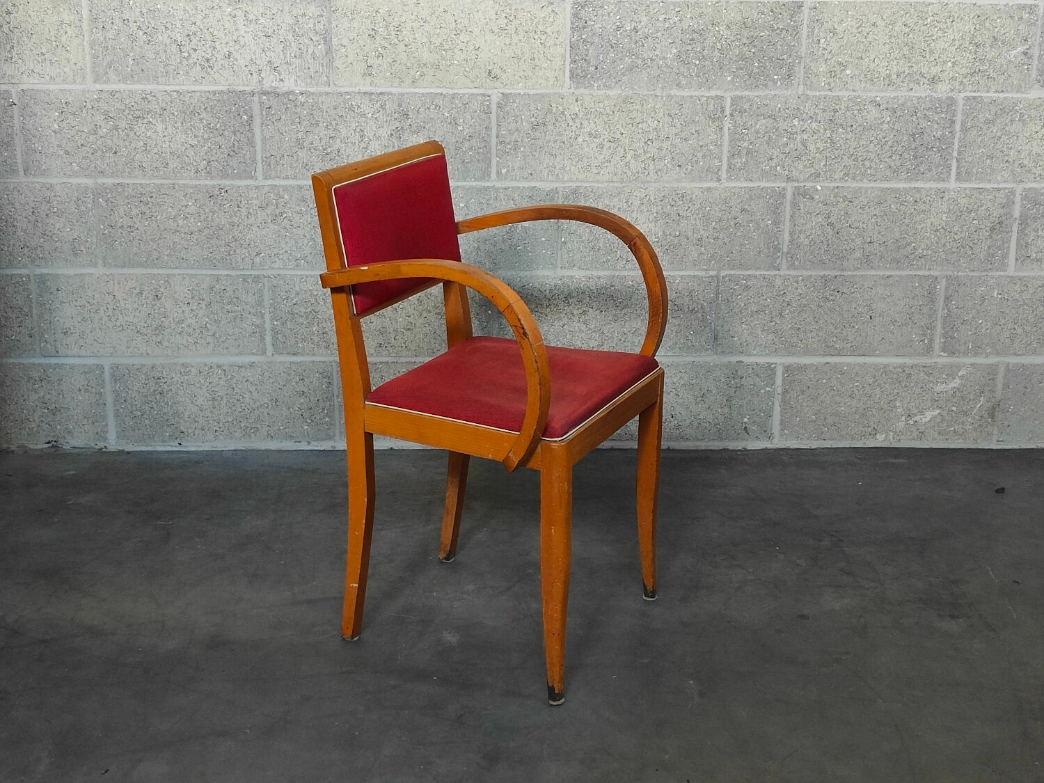 Small red bridge chair with armrests