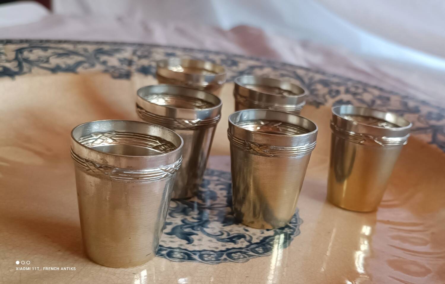 6 silver-plated metal glasses, decorated with a chased ribbon design