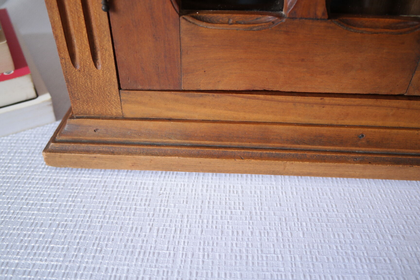 Antique walnut display cabinet from the 20th century.
