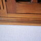 Antique walnut display cabinet from the 20th century.