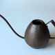 Old copper watering can with wooden handle, complete usuable, vintage from the 1960s