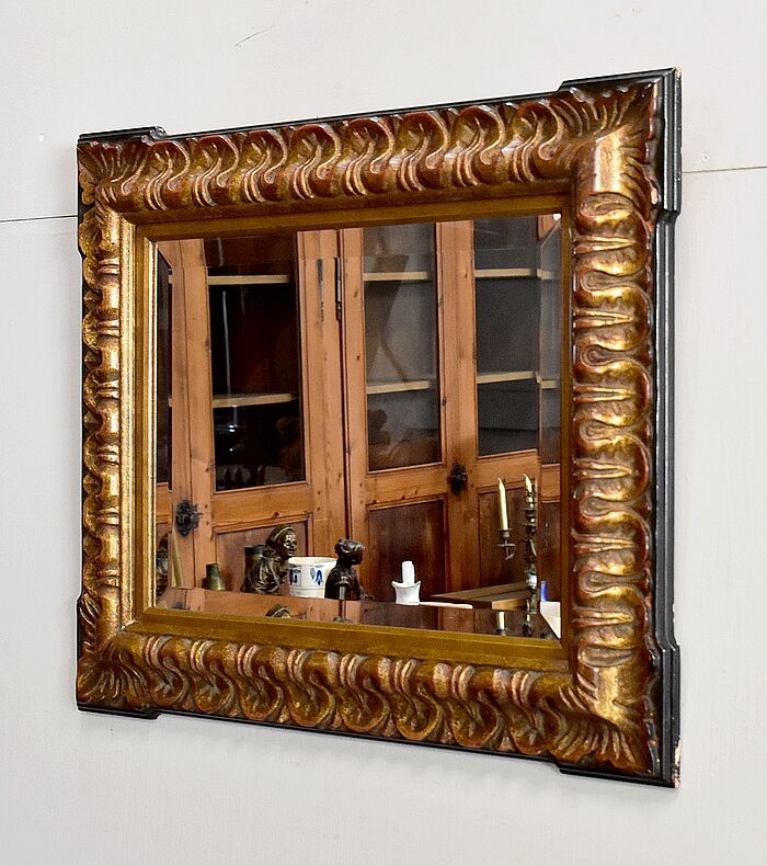 Gold-tinted wooden and stucco rectangular mirror - 1920