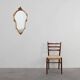 20th Century Louis XVI style giltwood mirror with ornate crest, France