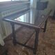 1960s Italian wooden table with a glass top.