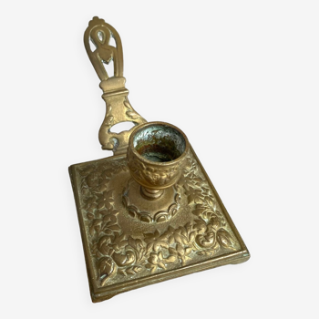 Old brass hand candle holder