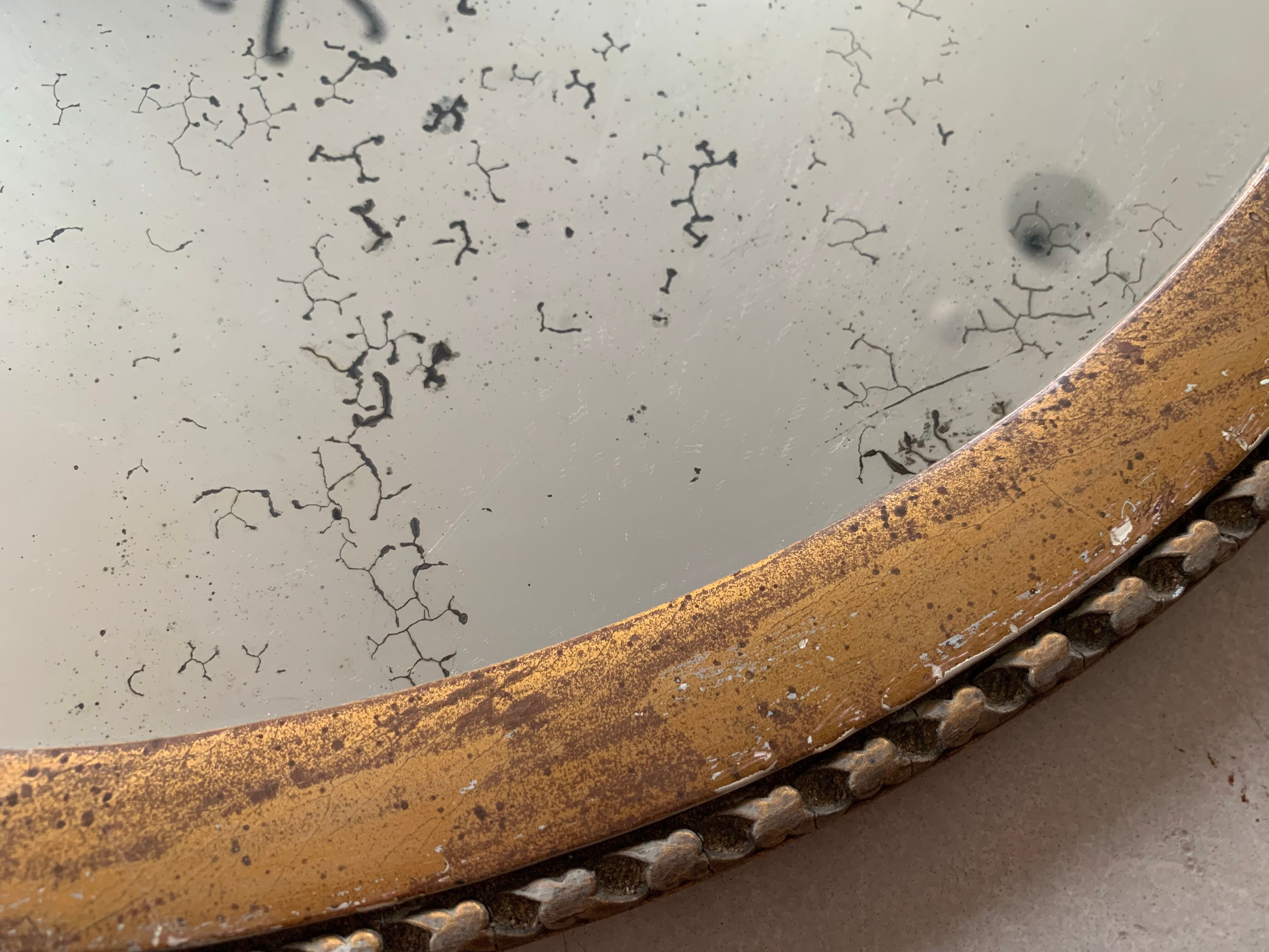 Old oval mirror stitched