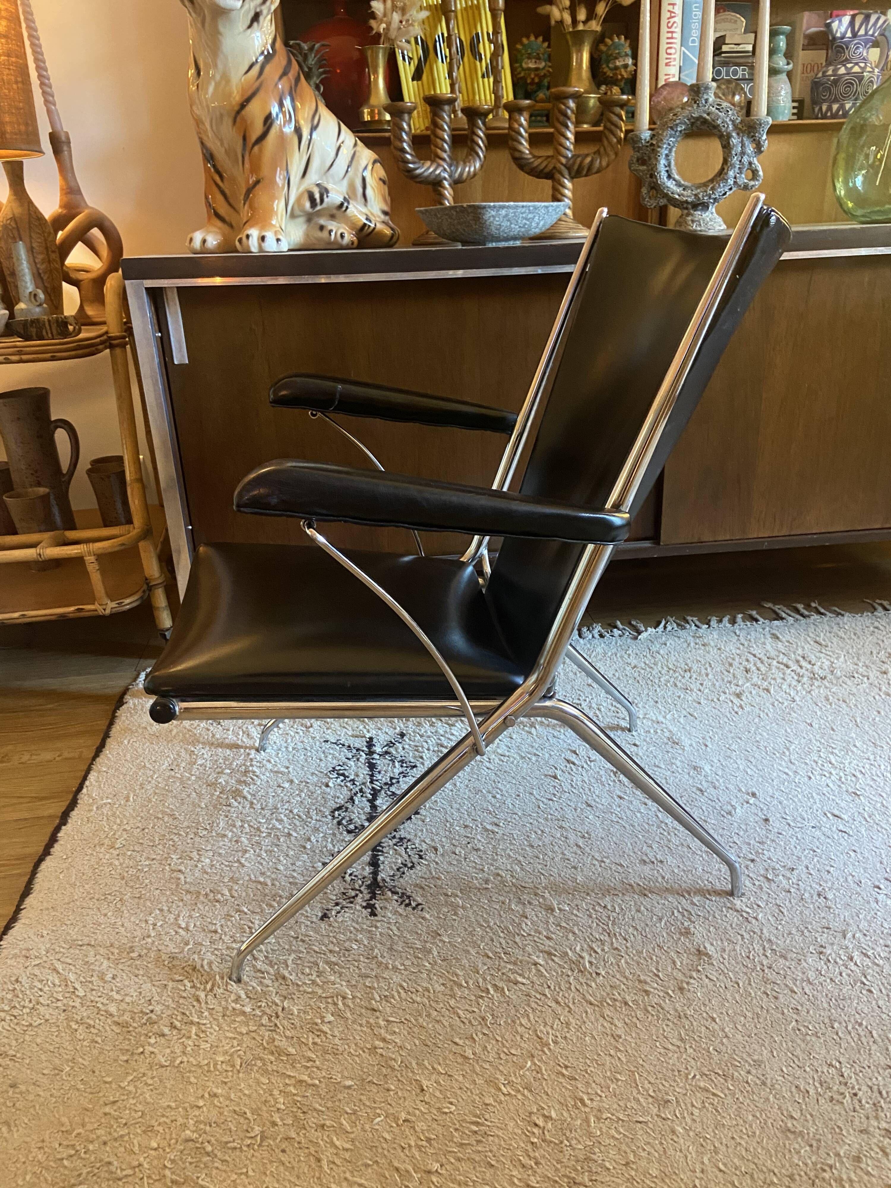 Metal armchair and black skaï