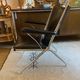 Metal armchair and black skaï