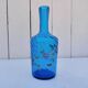 Vintage twisted blue glass carafe with enamel decoration.
