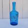 Vintage twisted blue glass carafe with enamel decoration.
