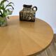Table basse tripode en bois et marqueterie bicolore design scandinave 1950