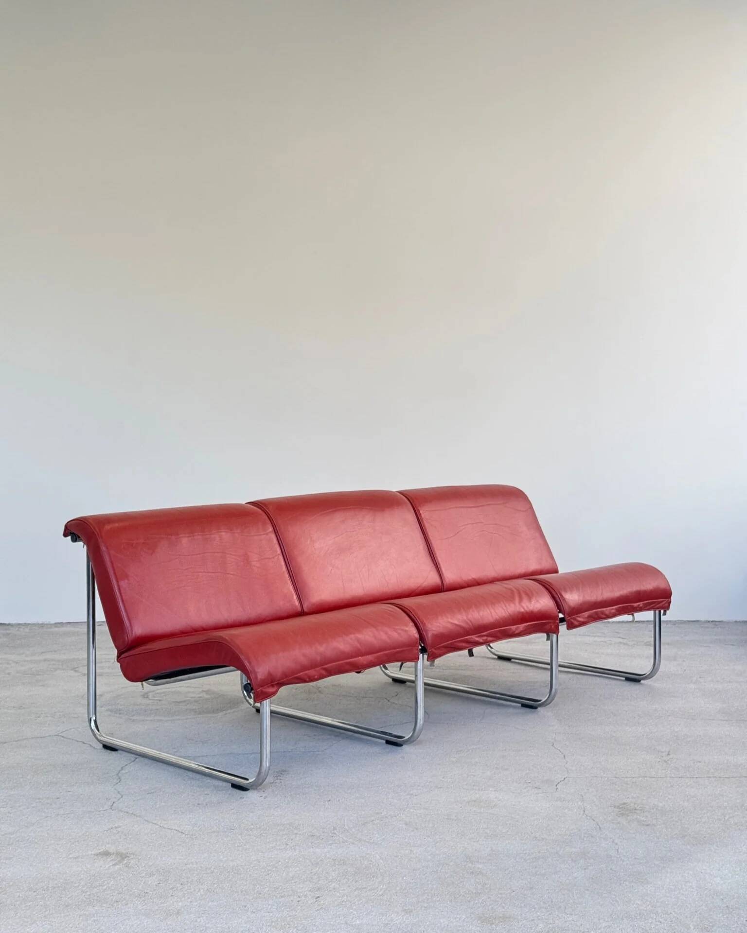 Red leather Remmi sofa by Yrjö Kukkapuro