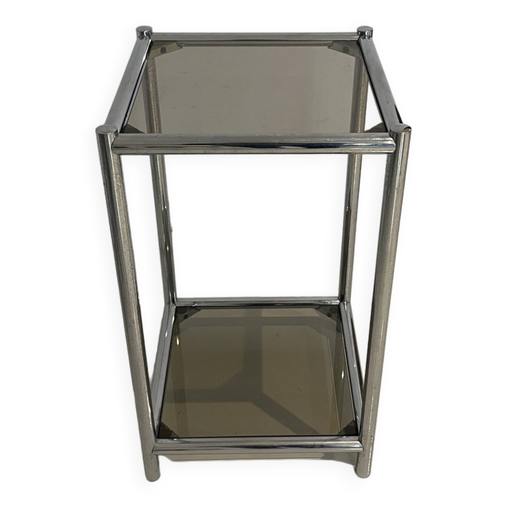 Bolster or end table in chrome steel with smoked window.