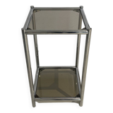 Bolster or end table in chrome steel with smoked window.
