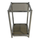 Bolster or end table in chrome steel with smoked window.