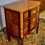 Transition style chest of drawers in rosewood and violet wood, ebony and gilded bronzes