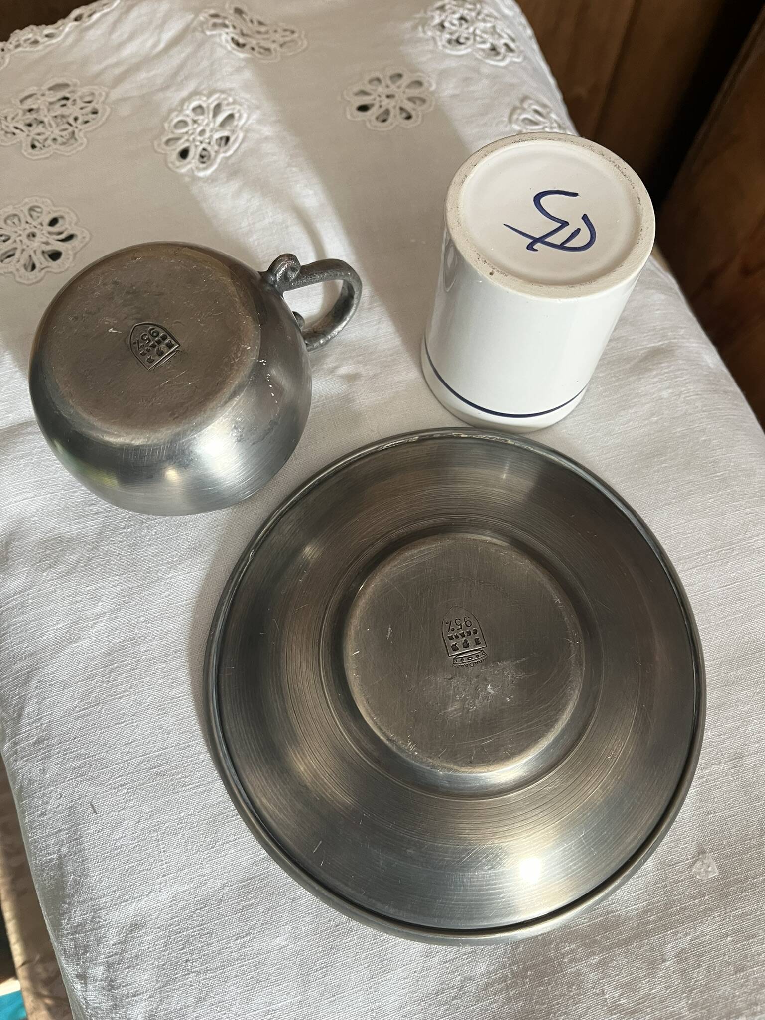 Pewter and porcelain cup and saucer