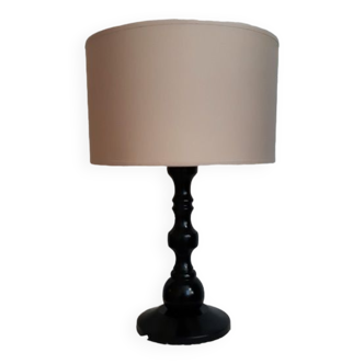 Table lamp in black lacquered turned wood.