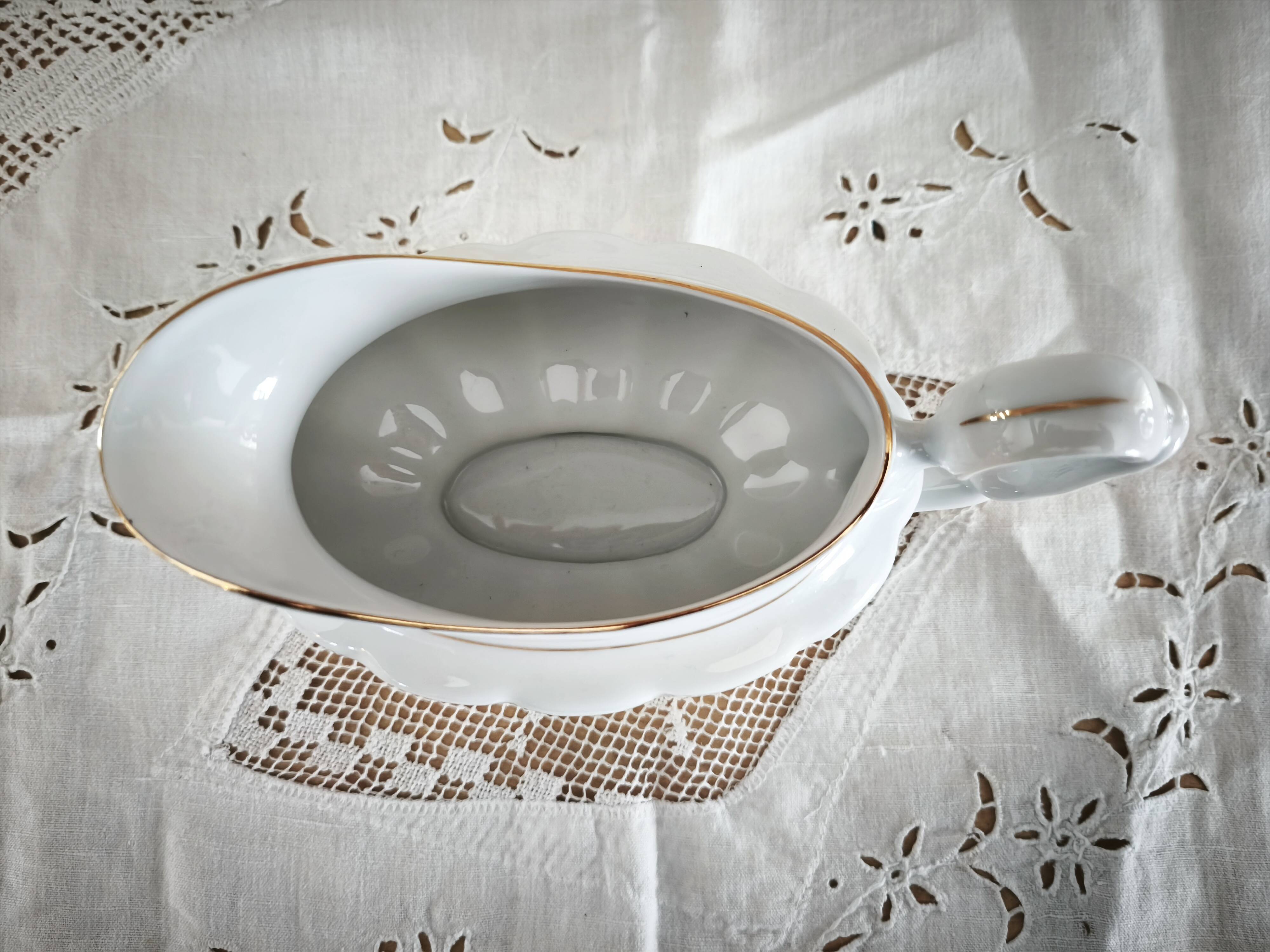 Porcelain sauceboat, white manufacture with double gold line, hand-painted.