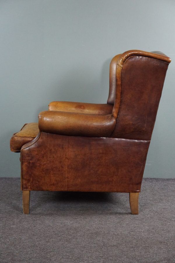 Armchair in patinated sheepskin leather