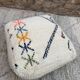 Berber floor pouf: Handwoven Moroccan wool cushion.