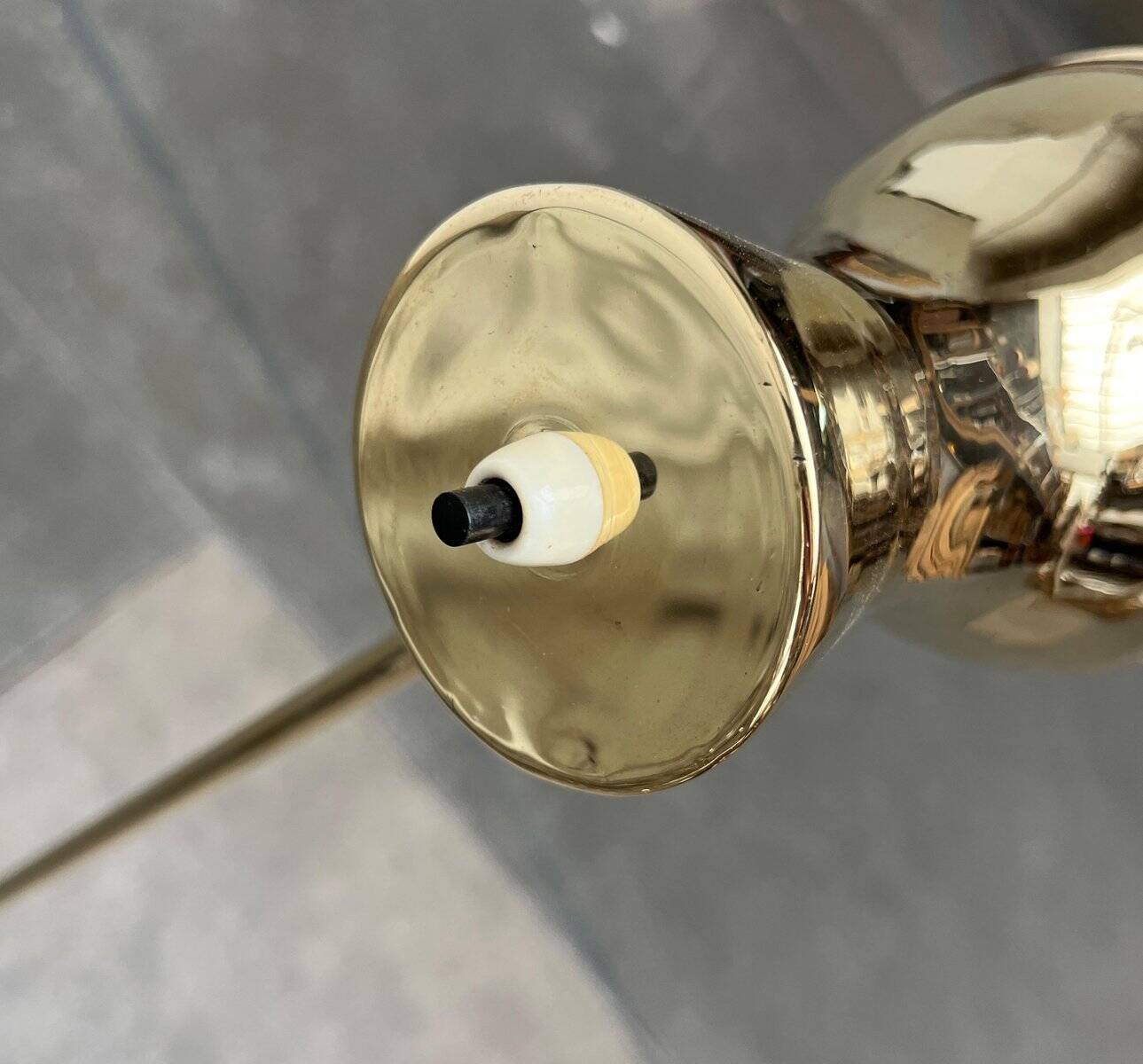 Minimalist brass floor lamp from the mid-century by Dieter Schulz for Wohnbedarf Ag, 1950s.