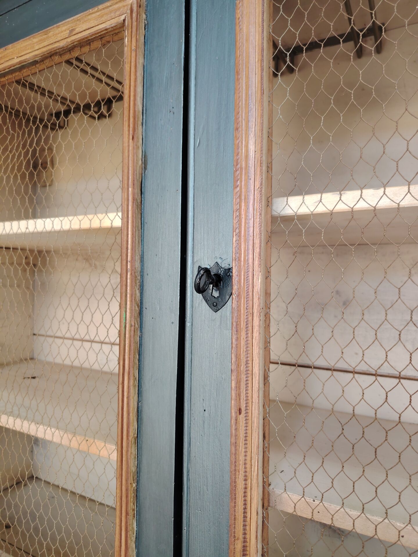 Large two-body grain merchant cabinet made of solid wood.