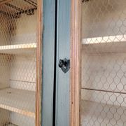 Large two-body grain merchant cabinet made of solid wood.