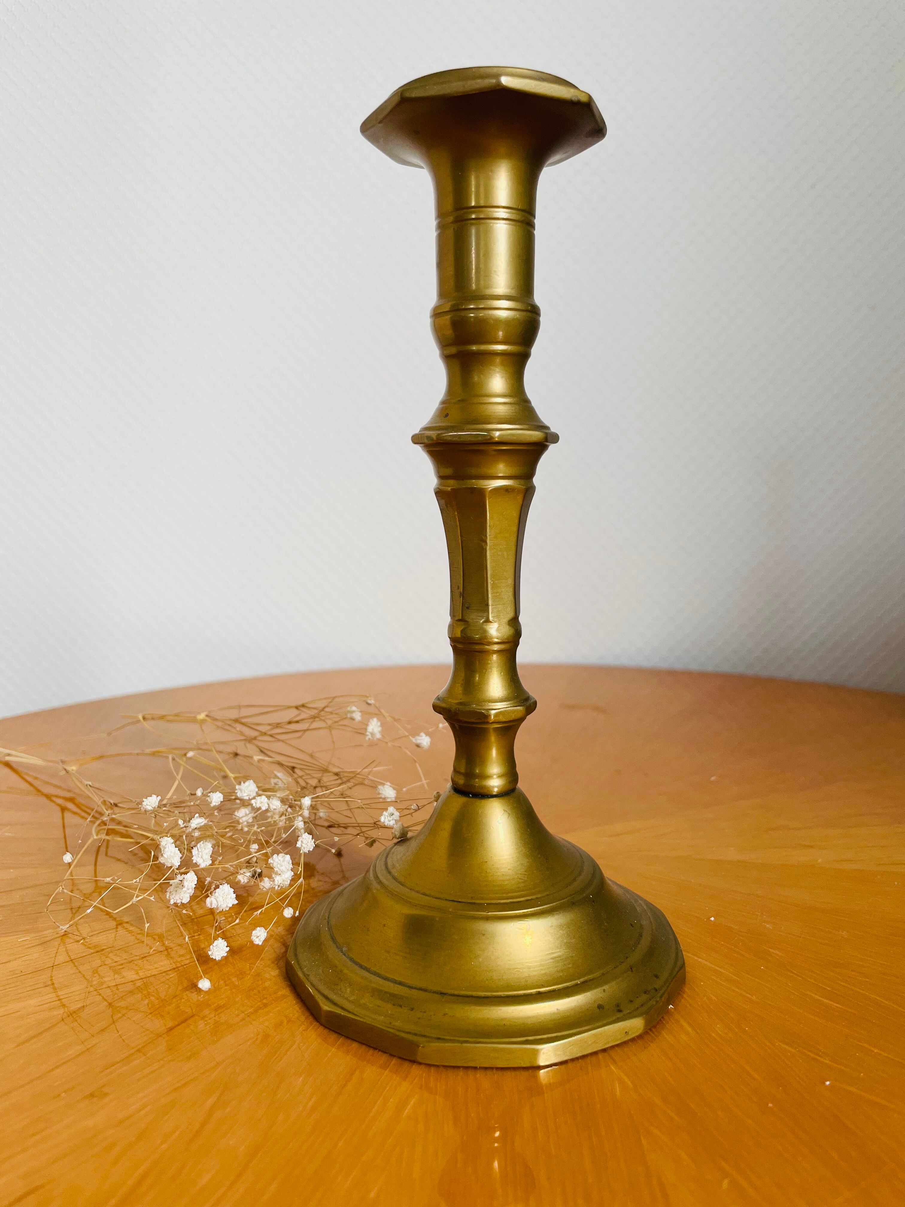 Old brass torch candle holder