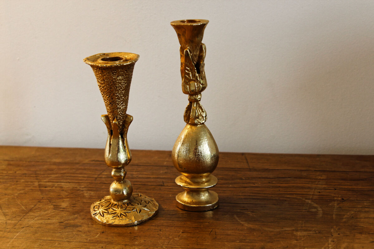 Pair of handmade candle holders, cast iron