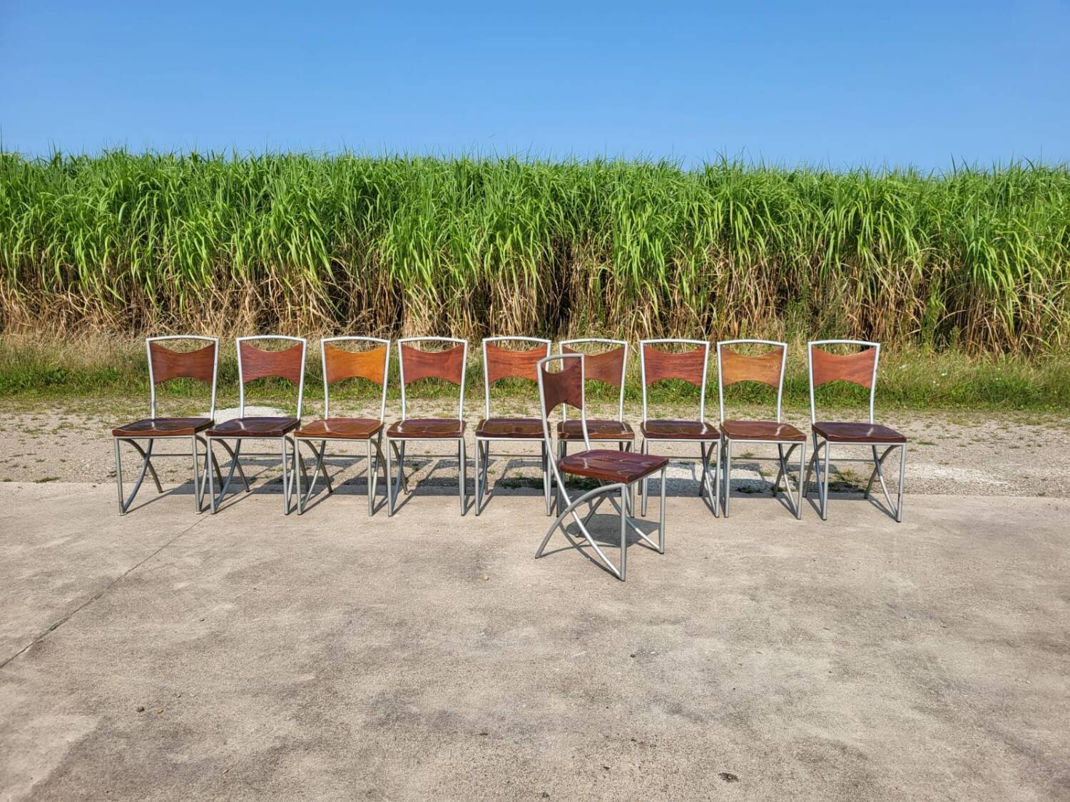 Set of 10 tubular oak bistro dining chairs in vintage industrial style.
