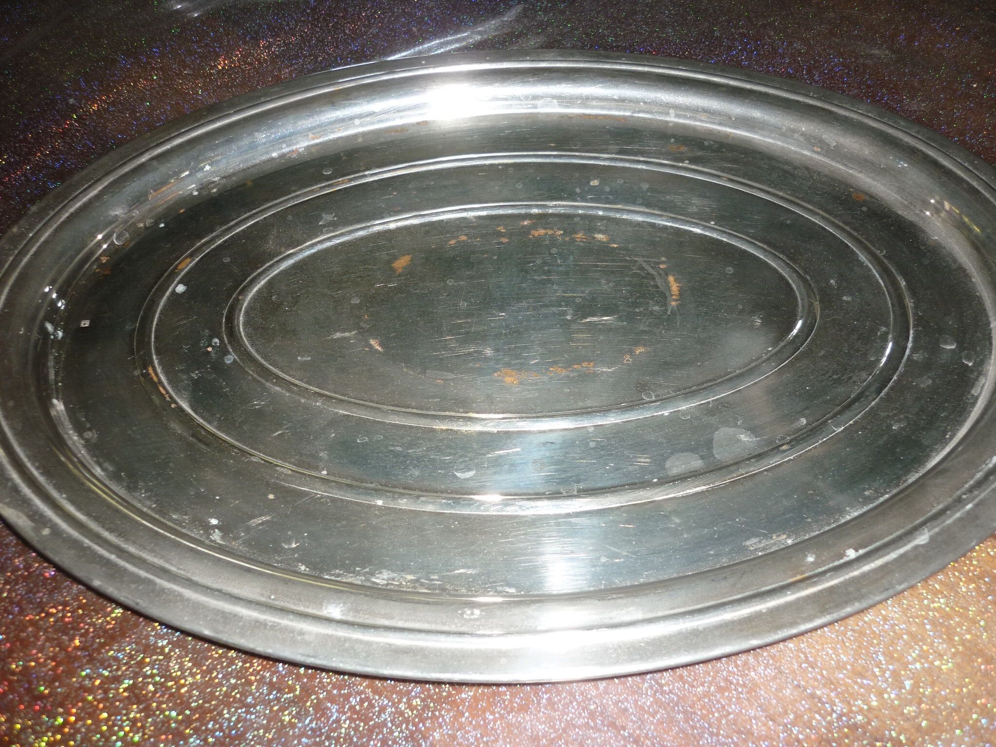 Silver metal oval top